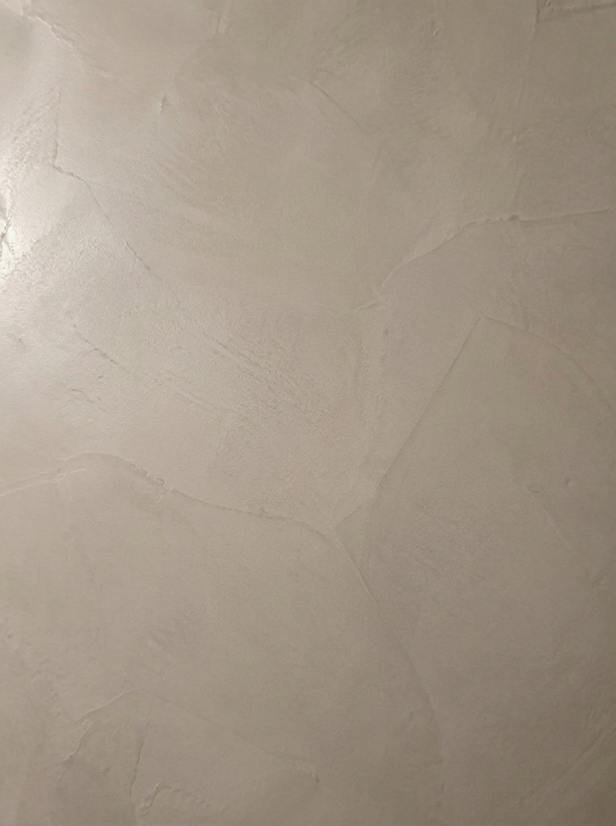 Close detail of smooth Raffles Paint microcement with very subtle tonal variation