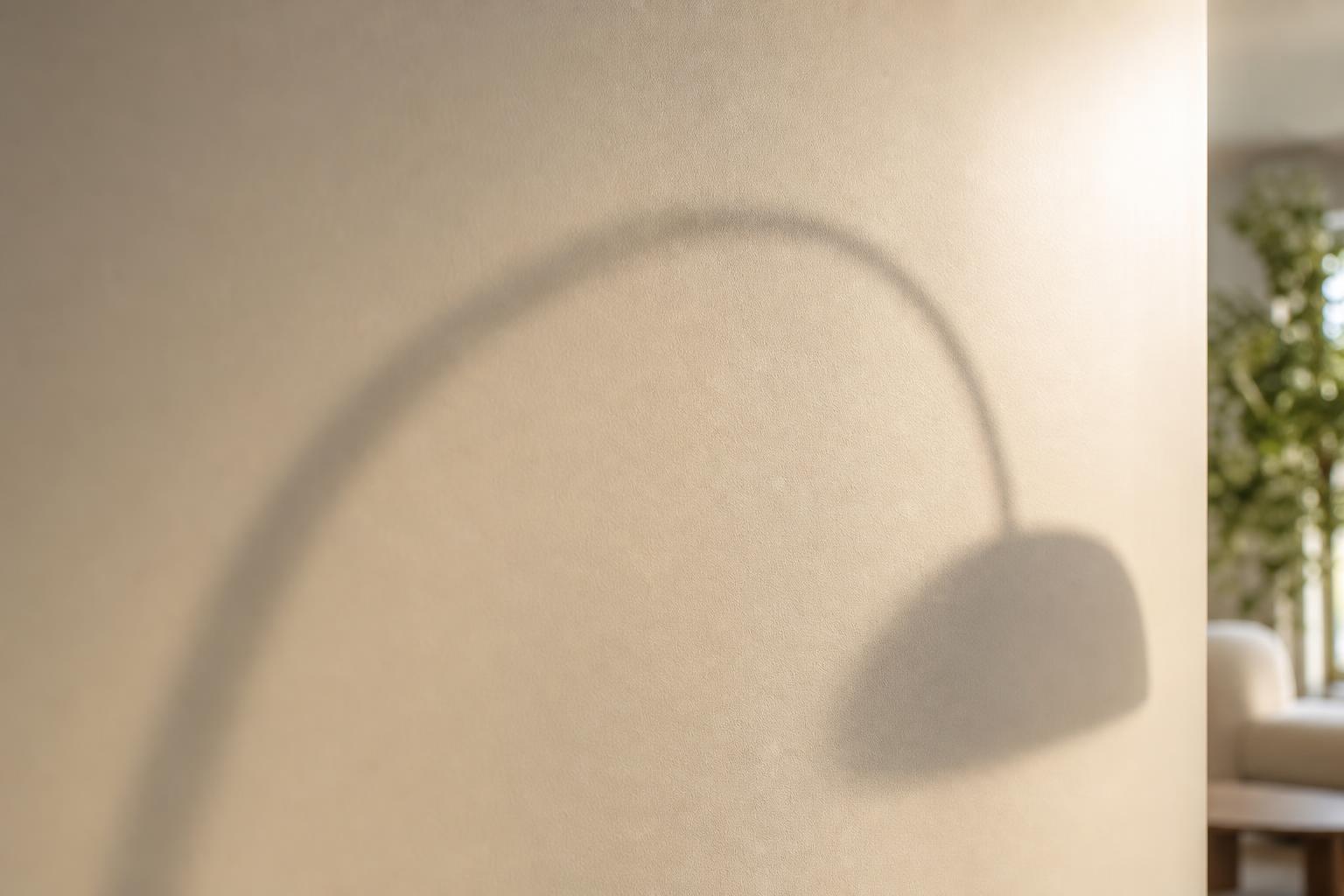 PXA warm putty wall in Zinsser eggshell finish, low afternoon light with arched lamp shadow
