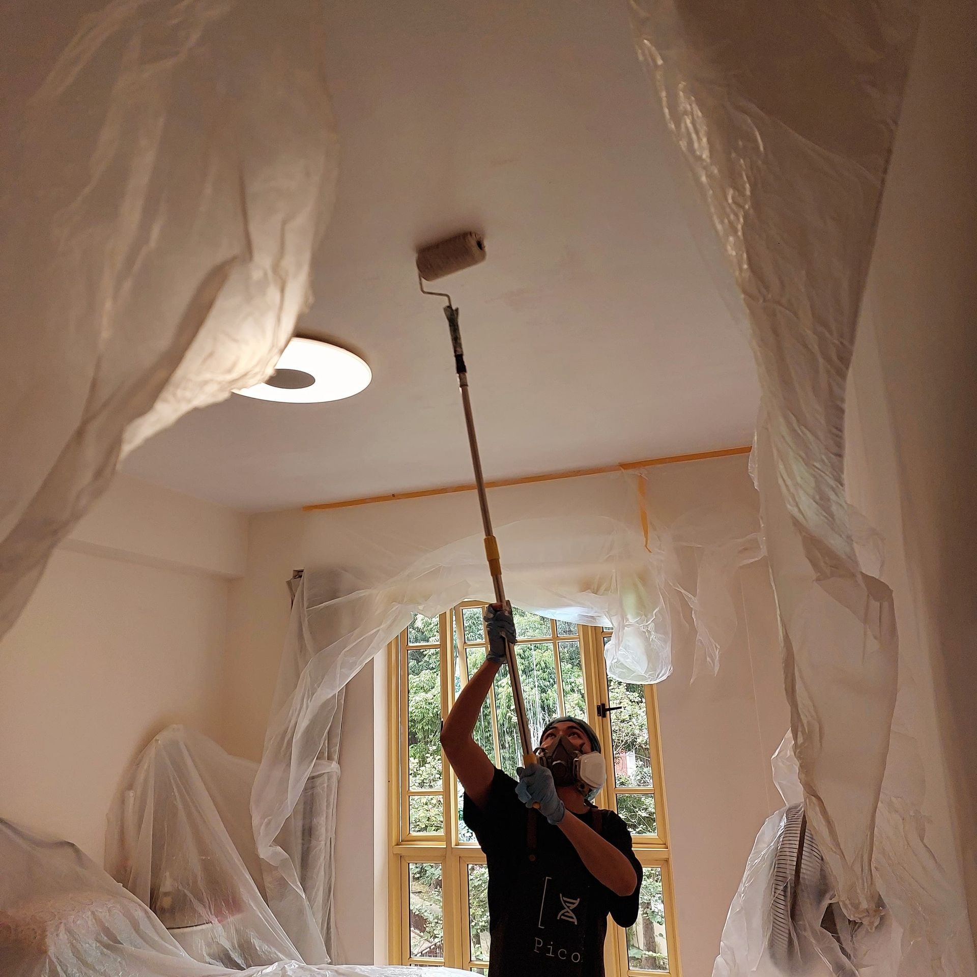 Pico X Health painter coating a Singapore HDB ceiling
