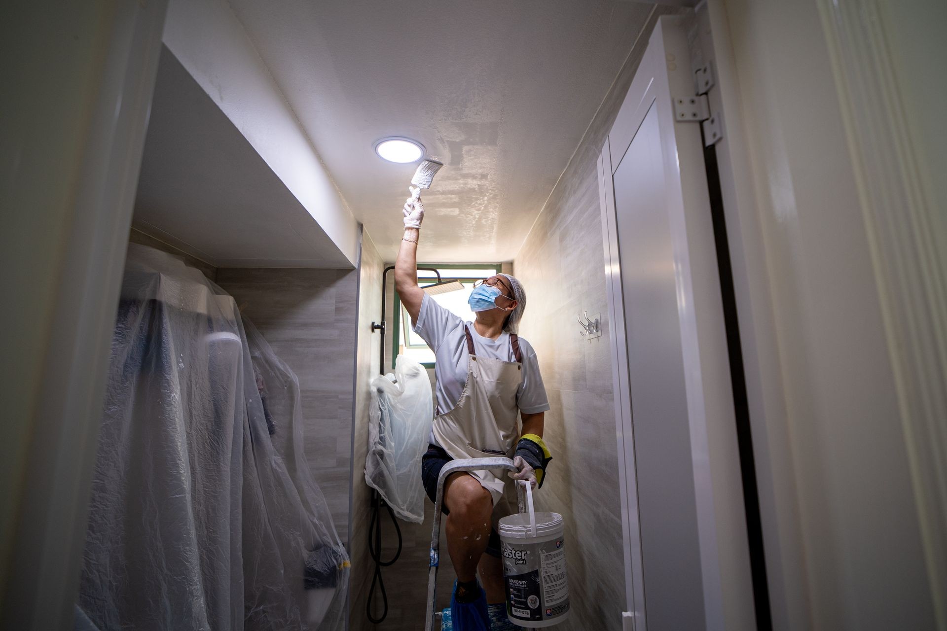 Detailed cutting-in work along a Singapore hallway by Pico X Health